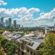 A view over a suburb of Sydney, Australia, with downtown Sydney, Sydney Opera House and Sydney Harbour Bridge in the background