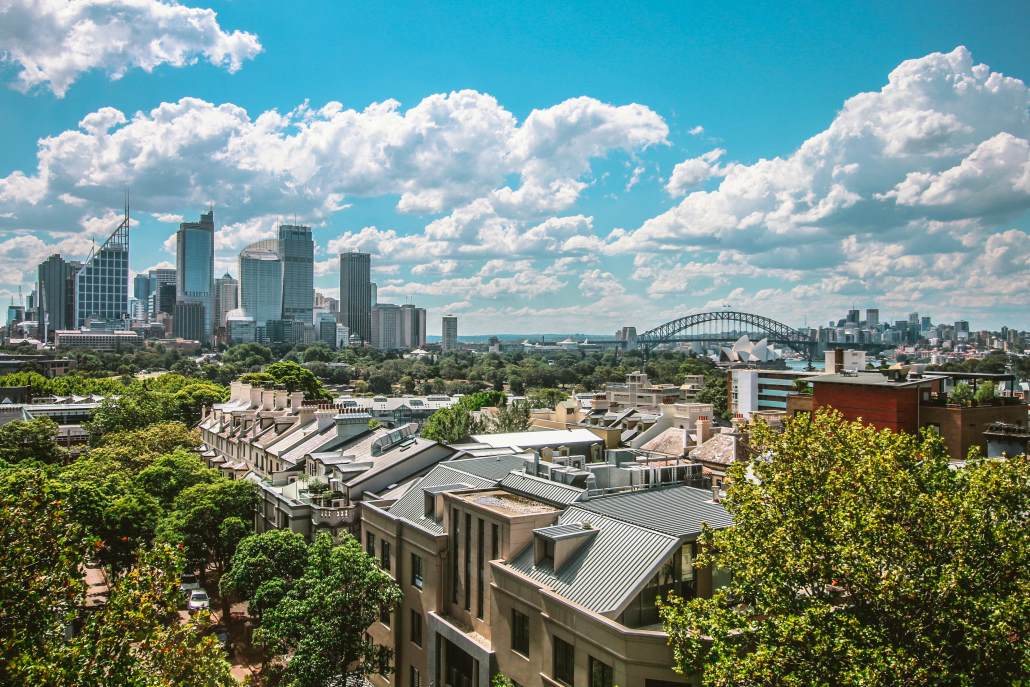 A view over a suburb of Sydney, Australia, with downtown Sydney, Sydney Opera House and Sydney Harbour Bridge in the background