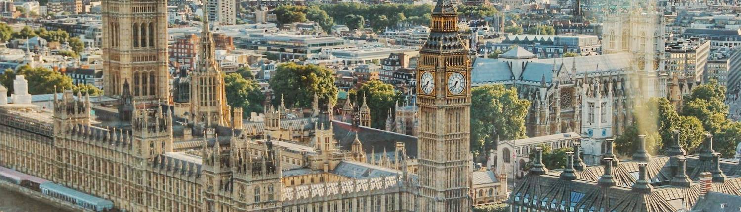 An aerial shot of Big Ben (Elizabeth Tower) and the Palace of Westminster, London